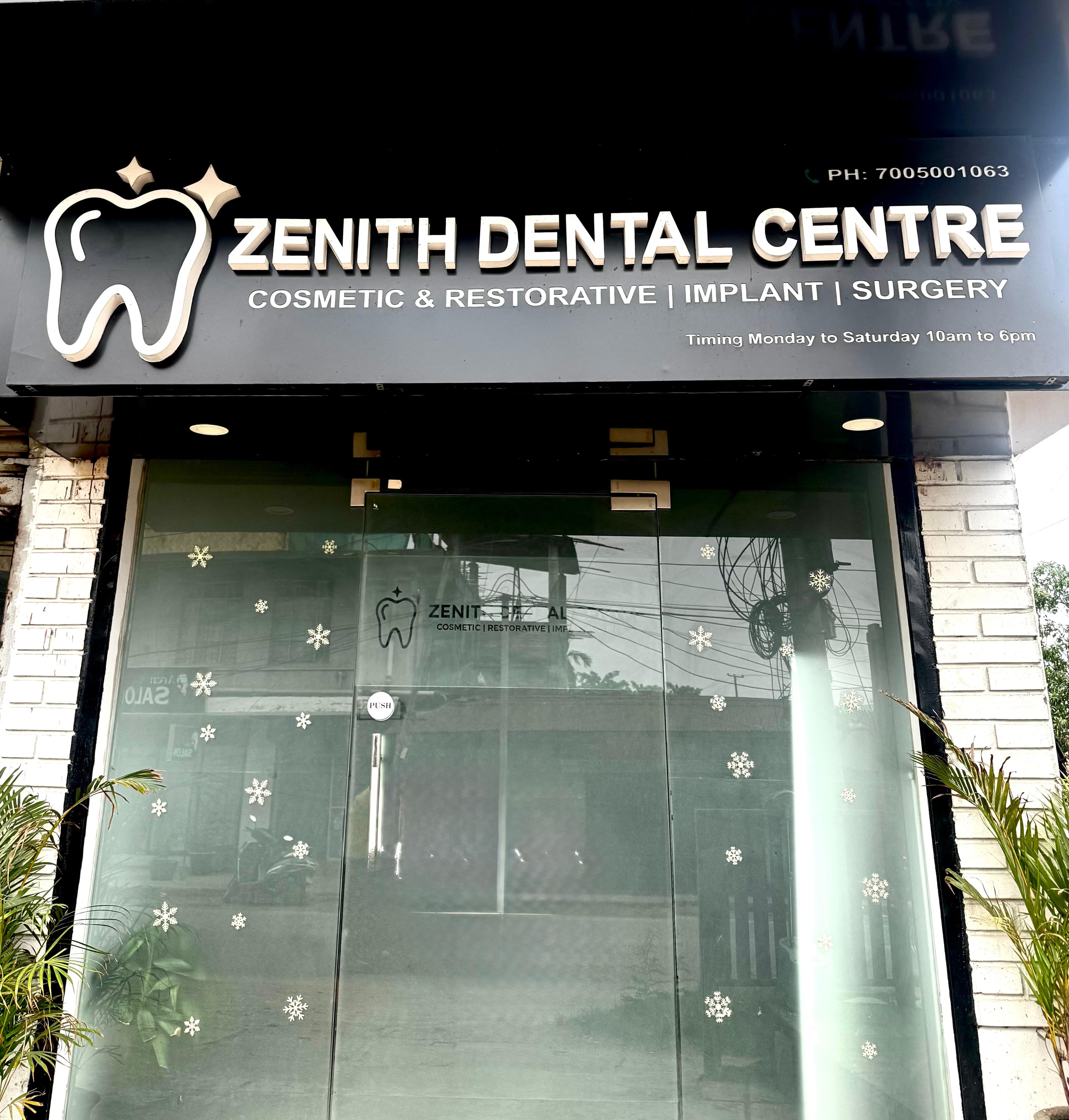 Zenith Dental Centre storefront with black signage, a tooth logo, and glass doors with snowflakes.